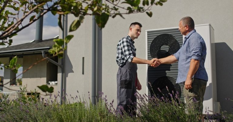 HVAC contractor and homeowner shaking hands
