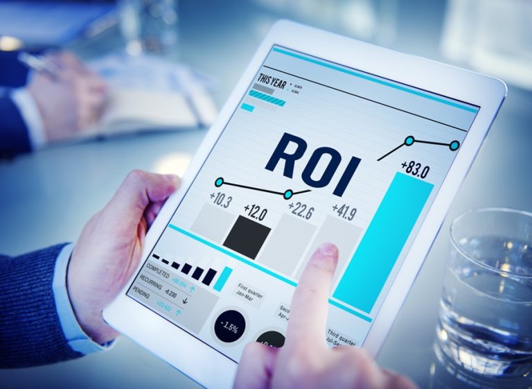 ROI performance metrics and data visualization on tablet screen in office setting