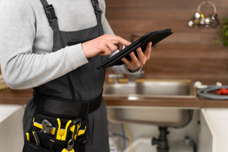 plumber using tablet